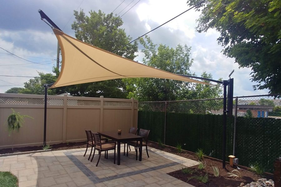 shade sails for fall over a backyard patio