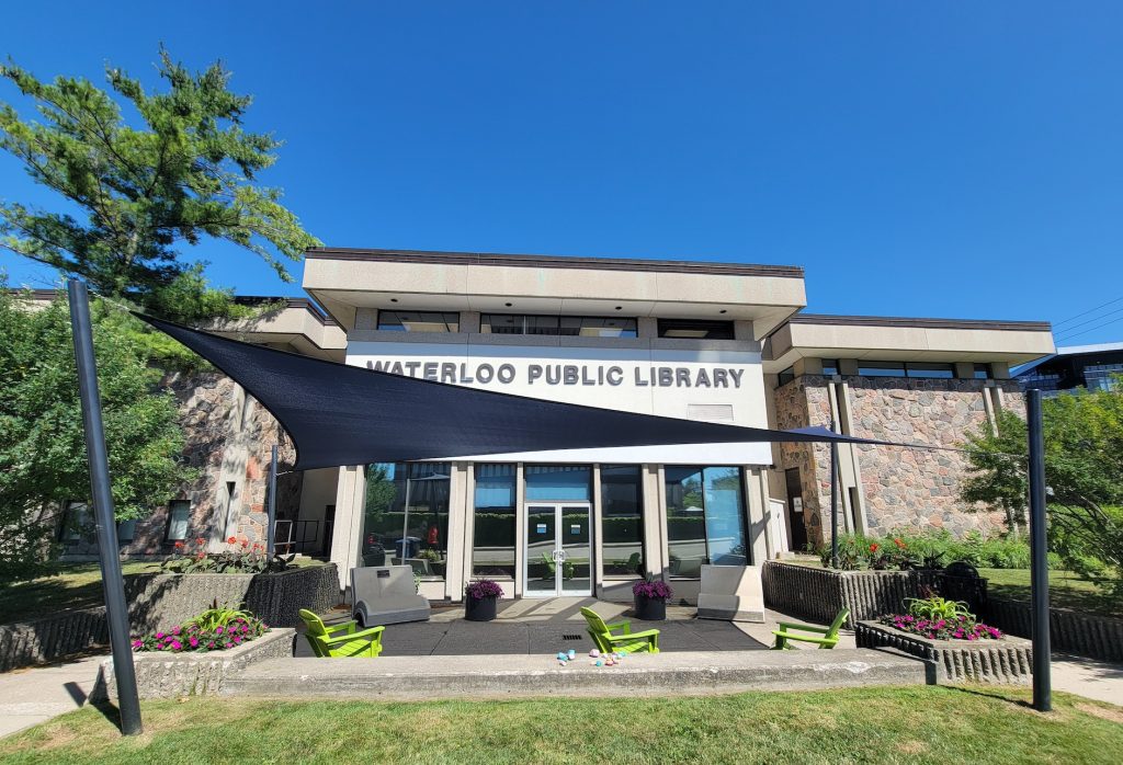 20250718_110402 Navy shade sail wide view Waterloo Public Library exterior Ontario