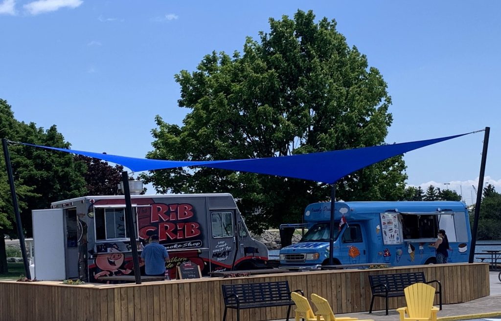 IMG_3704 Blue triangular shade sail Port Colborne waterfront food truck area Ontario